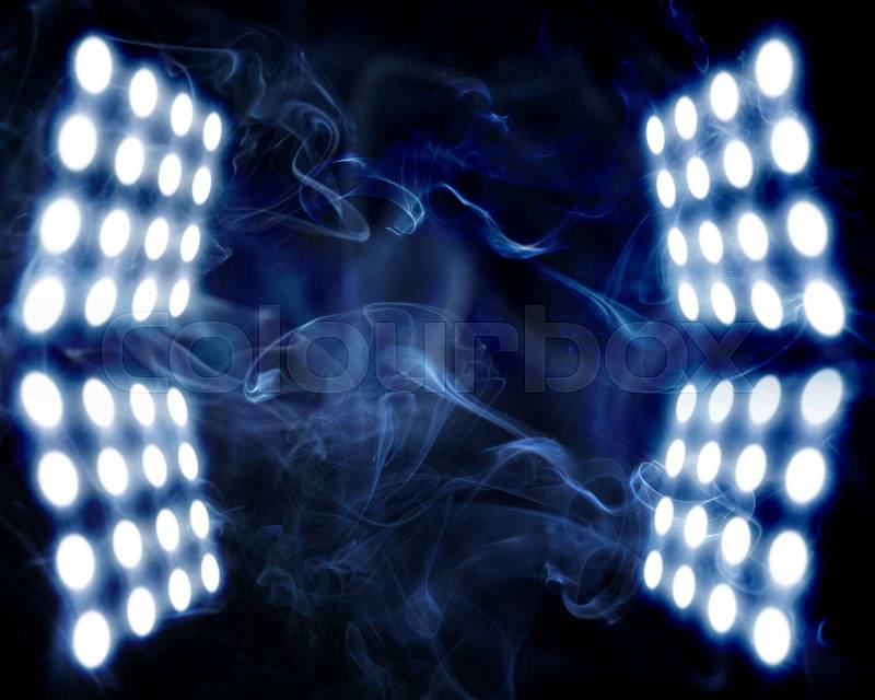 Stage spot lights in artificial abstract smoke, stock photo