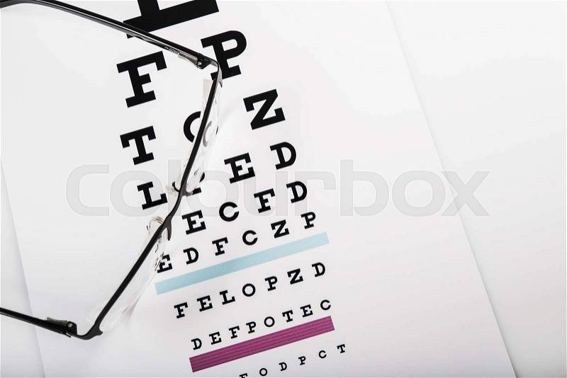 Eye glasses and test chart on white background, stock photo