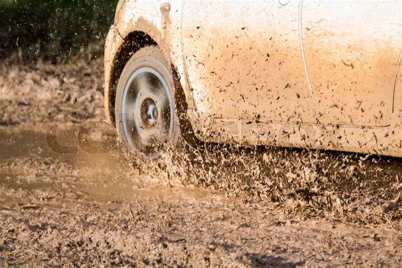 Mud debris from a rally car race ( Focus at debis), stock photo