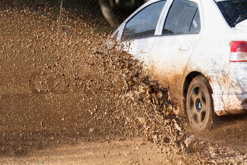 Mud debris splash from a rally car ( Focus at mud debis), stock photo