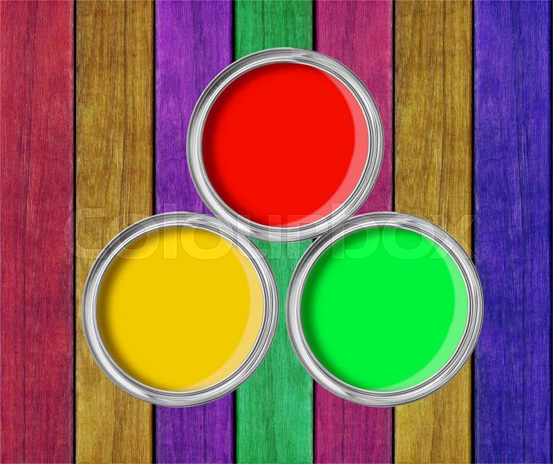 Open tin cans with paint on paint wooden background, stock photo