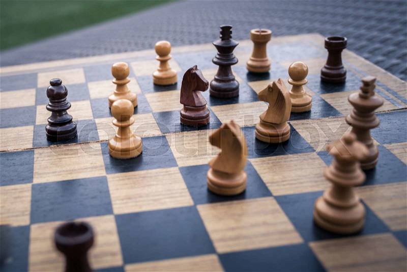 Wooden Chess board Business strategy idea concept background. Vintage dark corner style , stock photo