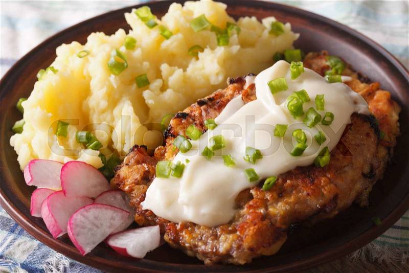 Chicken fried steak and white gravy with mashed potatoes on a plate close-up horizontal , stock photo