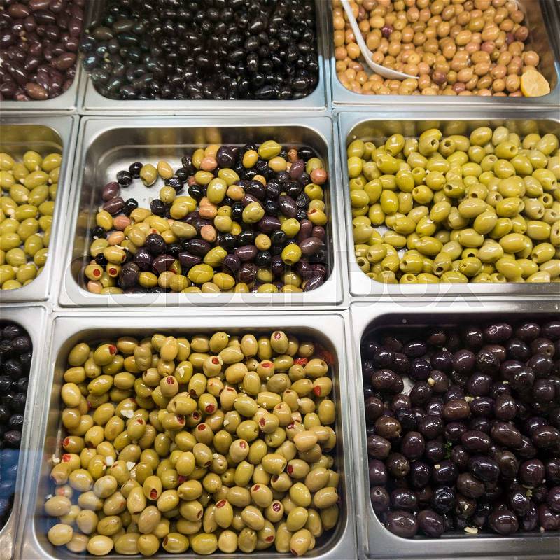 Stall of olives at the market. Green and black olives, stock photo