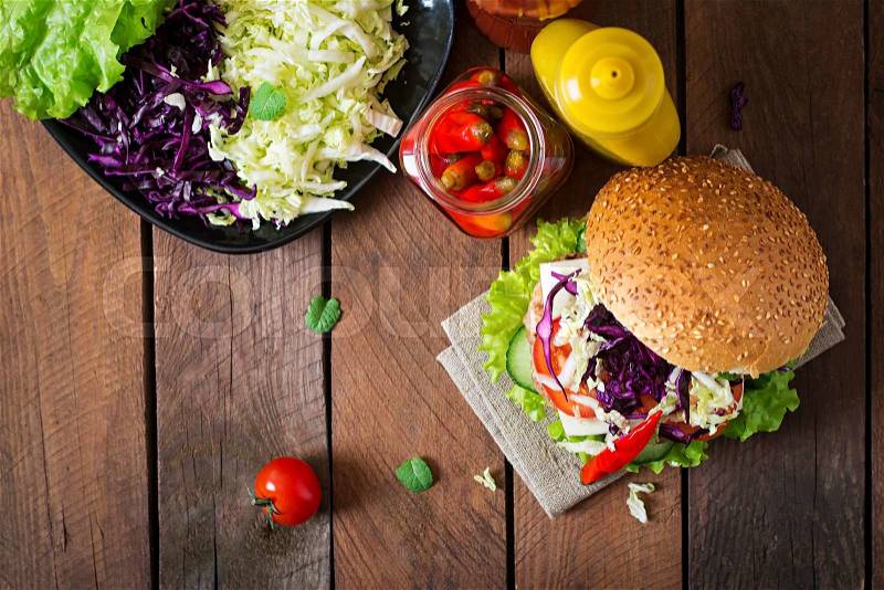 Sandwich hamburger with juicy burgers, cheese and mix of cabbage. Top view, stock photo