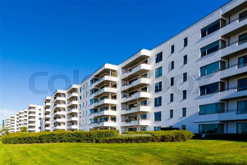 Modern white danish residential condominium building near Copenhagen, Denmark on a sunny day, stock photo
