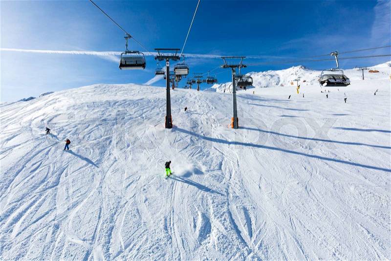 Ski lift above the ski pistes at the ski resort Soelden in Austria, stock photo