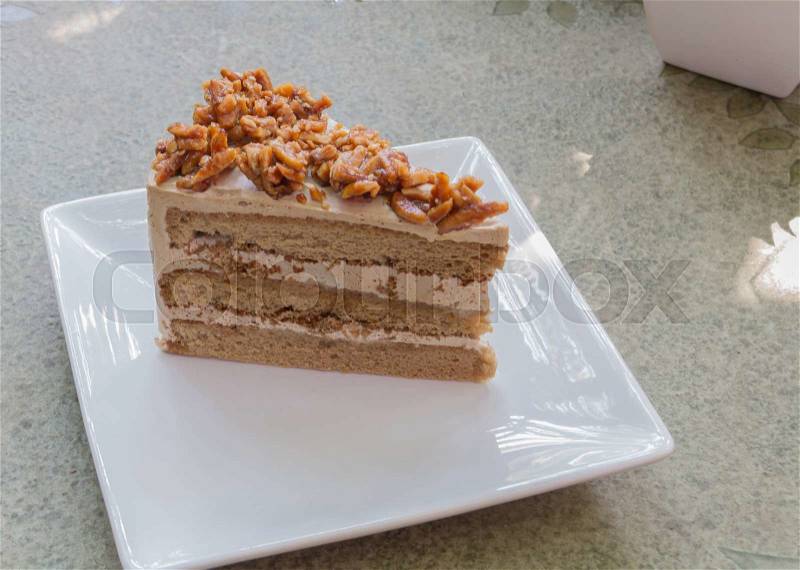 Almond cake on white dish, stock photo