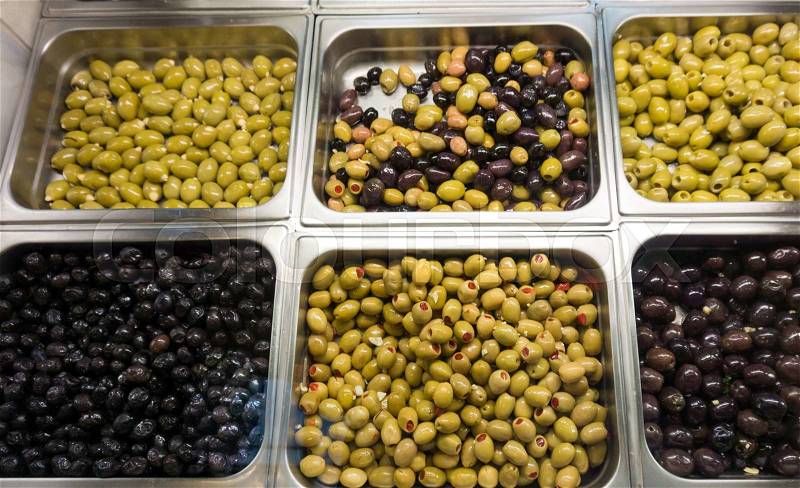 Stall of olives at the market. Green and black olives, stock photo