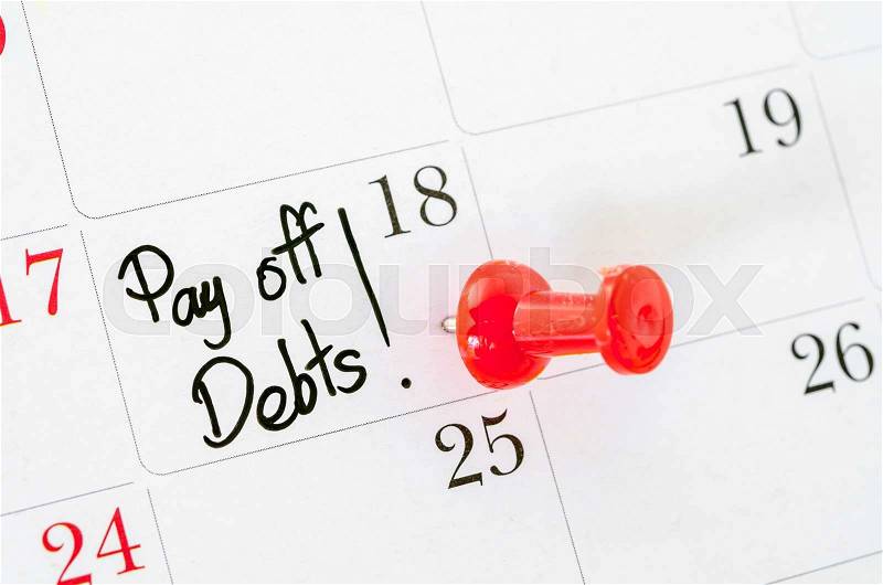 The words Pay off Debts written on a Calendar, stock photo