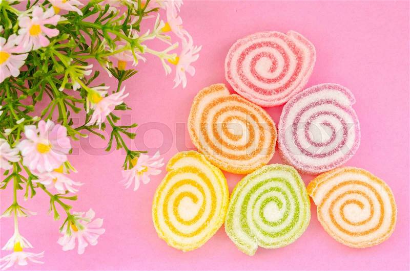 Jelly sweet, flavor fruit, candy dessert colorful with flower on pink background, stock photo