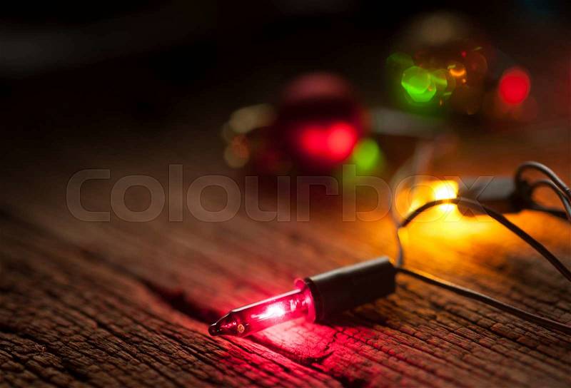 Christmas light decor on wood background, selective focus, stock photo