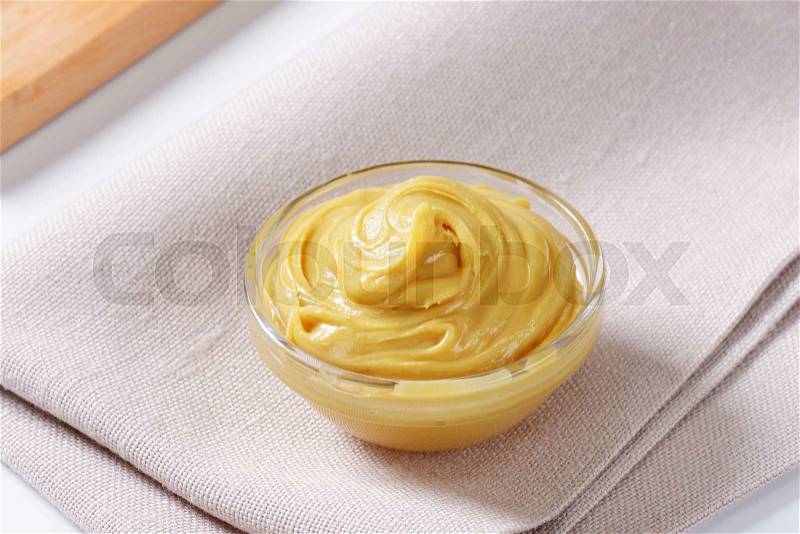 Bowl of smooth peanut butter, stock photo
