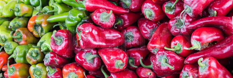 Closeup of green and red hot chili peppers, paprika, stock photo