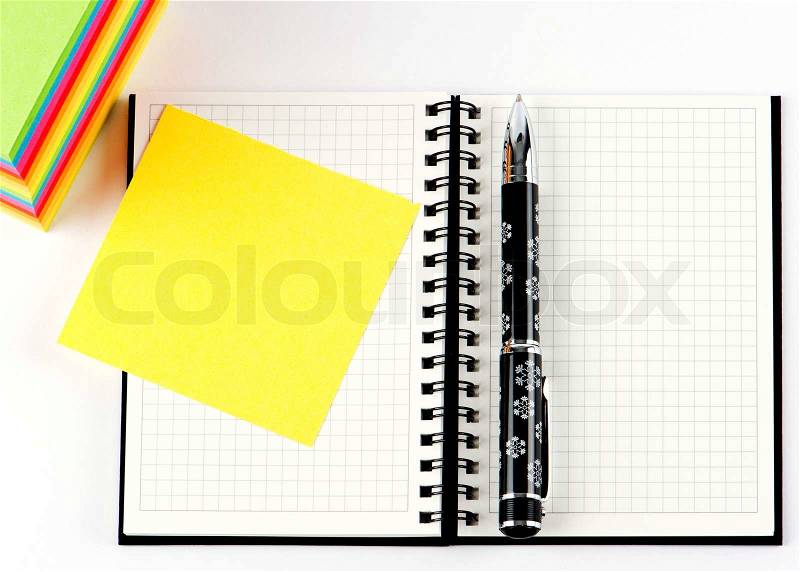 Pencil on open note book. Colorful paper notes, stock photo