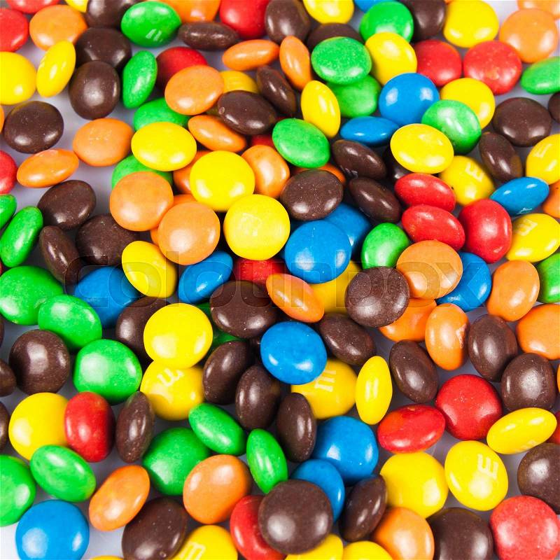 Close up of a pile of colorful chocolate coated candy . color candy, stock photo