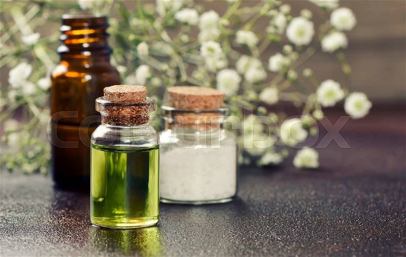 Organic essential oils or other cosmetics in bottles, stock photo