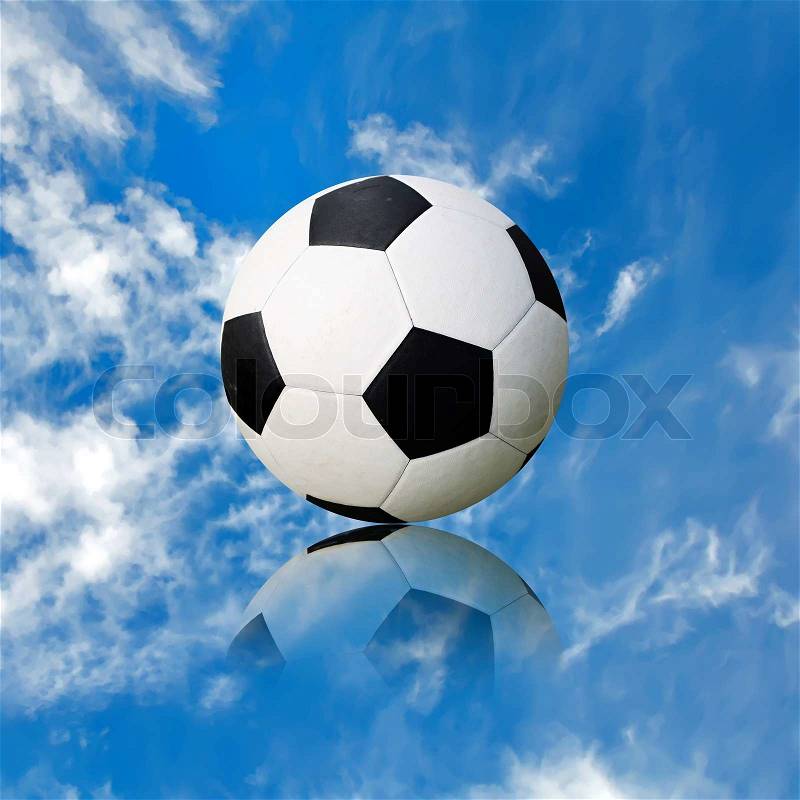 Ball soccer ball against the blue sky, stock photo