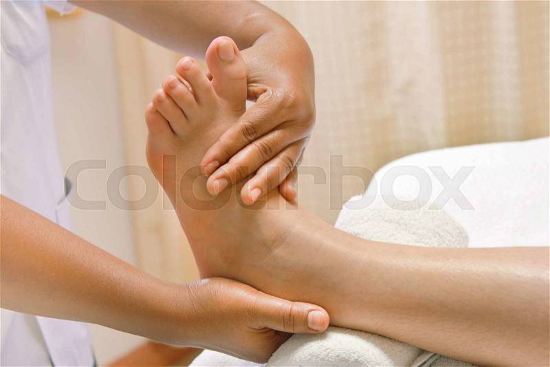 Reflexology Thai foot massage, spa foot treatment , stock photo
