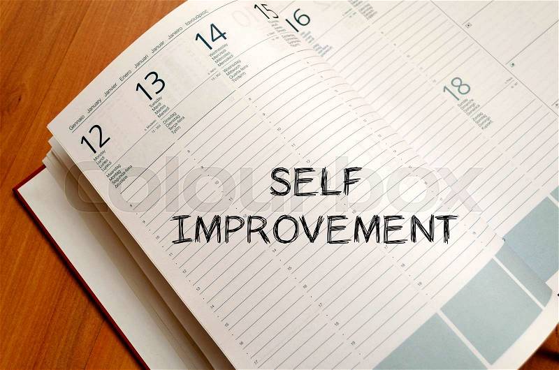 Self improvement text concept write on notebook with pen, stock photo