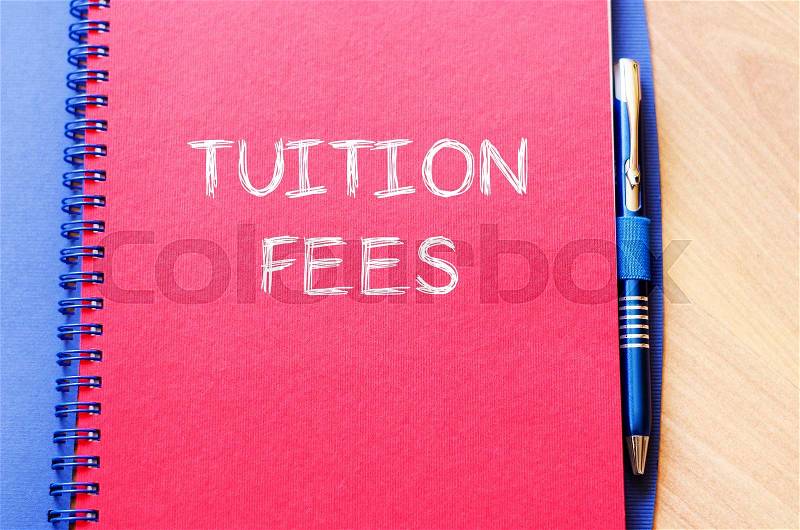 Tuition fees text concept write on notebook with pen, stock photo