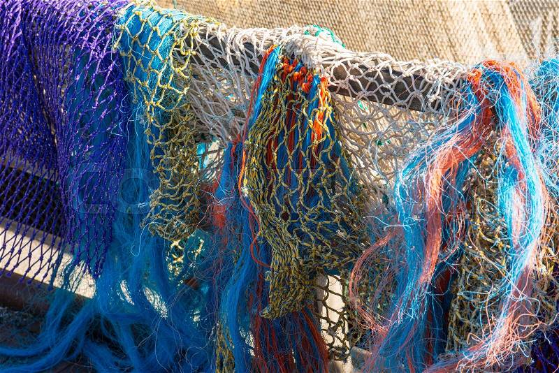 Colored fishing nets in a Dutch fishing port , stock photo