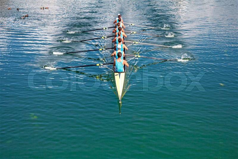 Boat coxed eight Rowers training rowing on the lake, stock photo