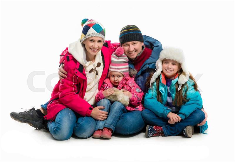 Family in warm clothes alltogether isolated on white background, stock photo