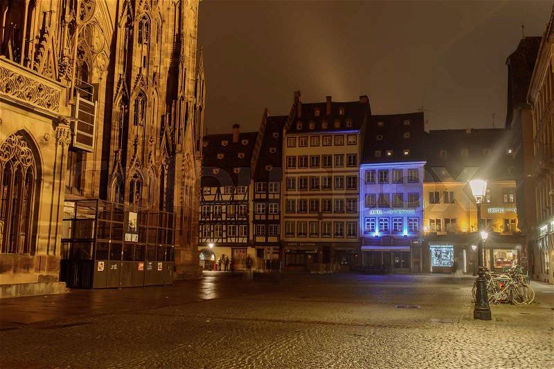 Square Cathedral of Notre-Dame in Strasbourg at night in the fog, stock photo