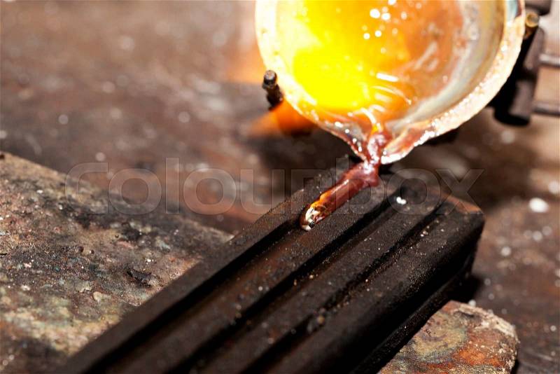 A Melting silver in a jewelry workshop, stock photo