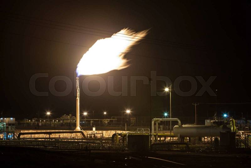 Gas flame torch on a oil refinery plant. Oil industry in Bahrain, Middle East, stock photo