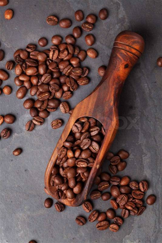 Coffee beans on stone table. Top view, stock photo