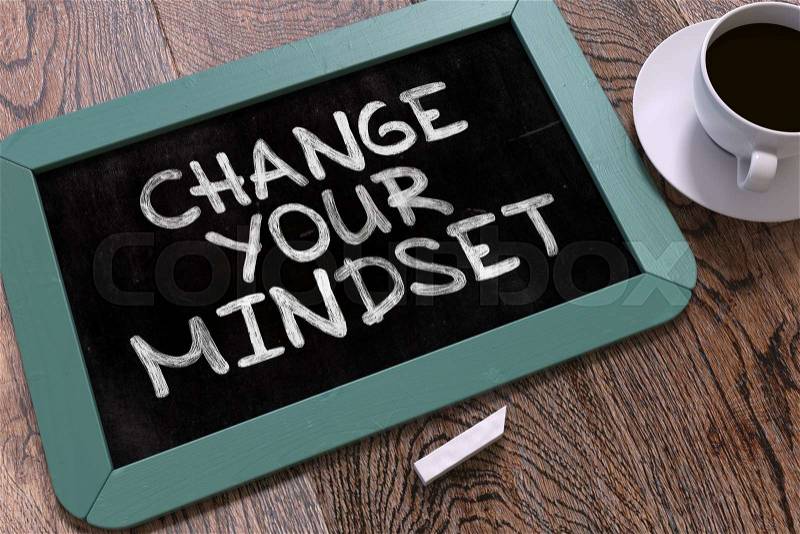 Change Your Mindset. Motivation Quote Hand Drawn on Blue Chalkboard on Wooden Table. Business Background. Top View, stock photo