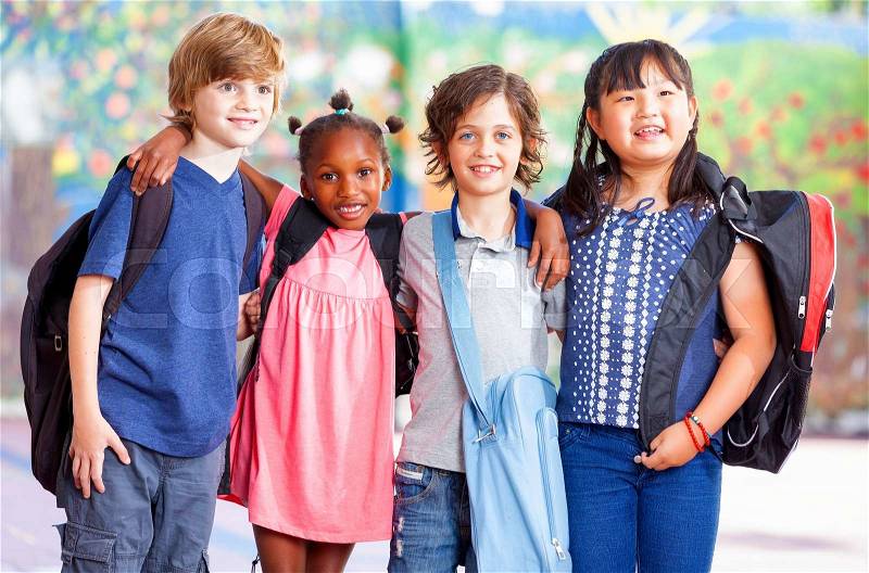 Group of kids going to school together, stock photo