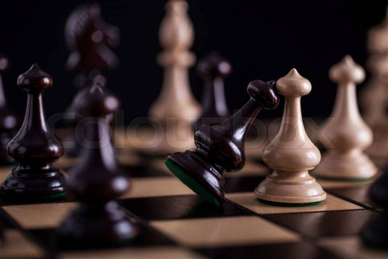 Chess. White pawns vs black on wooden chessboard, stock photo
