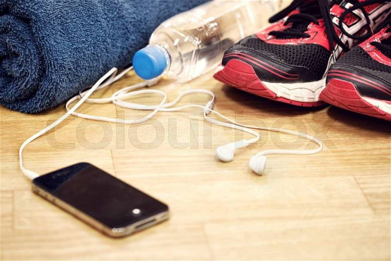 Sports shoes and water sports accessories with blurred focus, stock photo