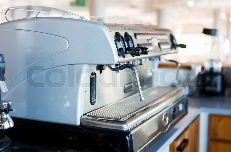 Equipment, object and technology concept - close up of coffee machine at bar or restaurant kitchen, stock photo