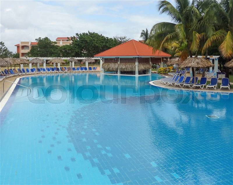 A holiday resort with big blue pool in Cuba, stock photo