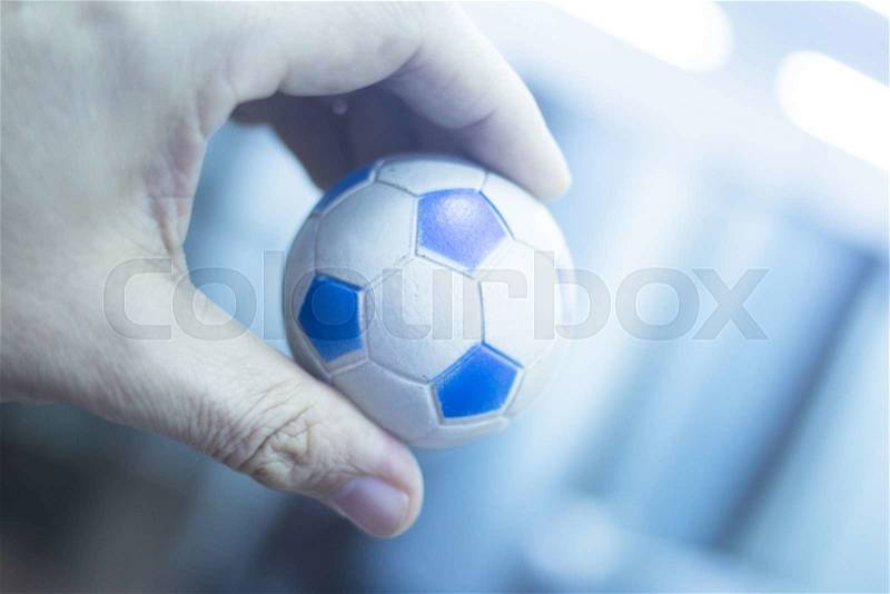 Wrist finger hand strength physiotherapy ball being held and compressed in sports injury physiotherapist medical center, stock photo
