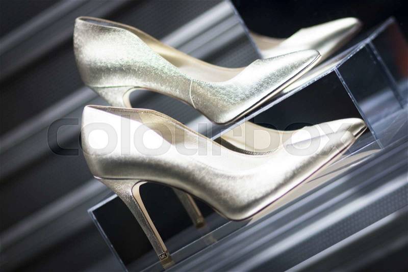 Shop window fashion store designer luxury leather shiny polished shoes, stock photo
