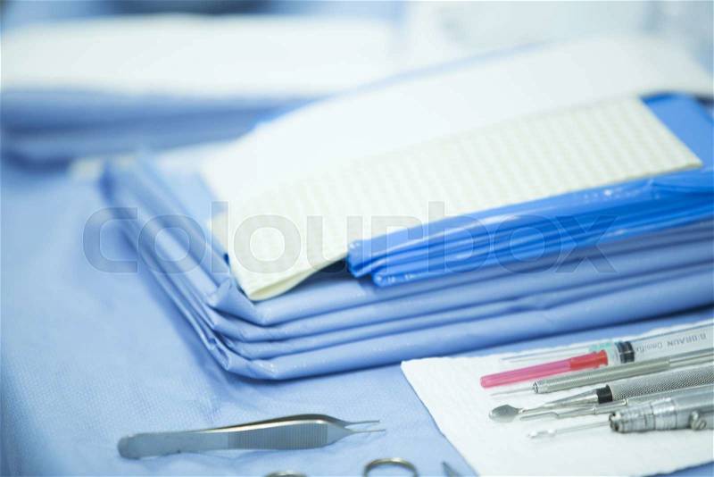 Hospital emergency surgery operating room medical clinic instruments on sterilized table real life photo, stock photo