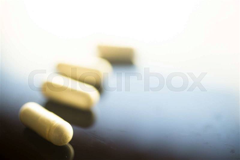 Multivitamin mineral pills health food supplements, stock photo