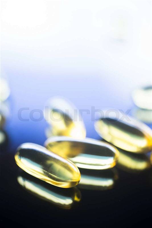 Cod liver fish oil omega 3, 6 and 9 capsules health food supplements, stock photo