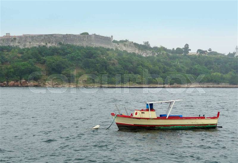 A small boat on the ocean seen in Cuba, stock photo