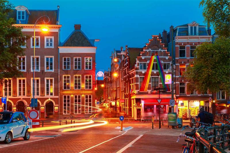 Night city view of Amsterdam street with typical dutch houses, Holland, Netherlands, stock photo