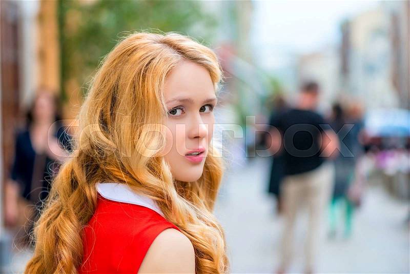 A casual portrait of a beautiful girl turning back, stock photo