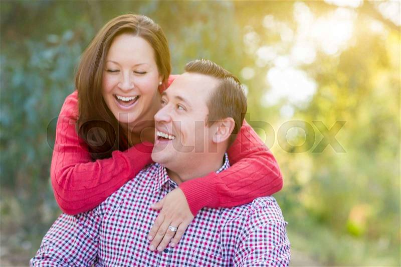 Attractive Happy Caucasian Couple Laughing Outdoors, stock photo