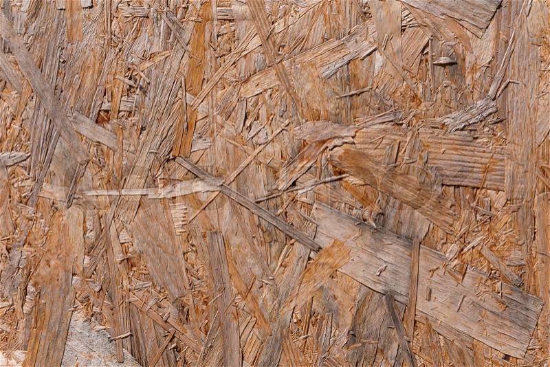 Old plywood recycled compressed wood chippings board background texture, stock photo