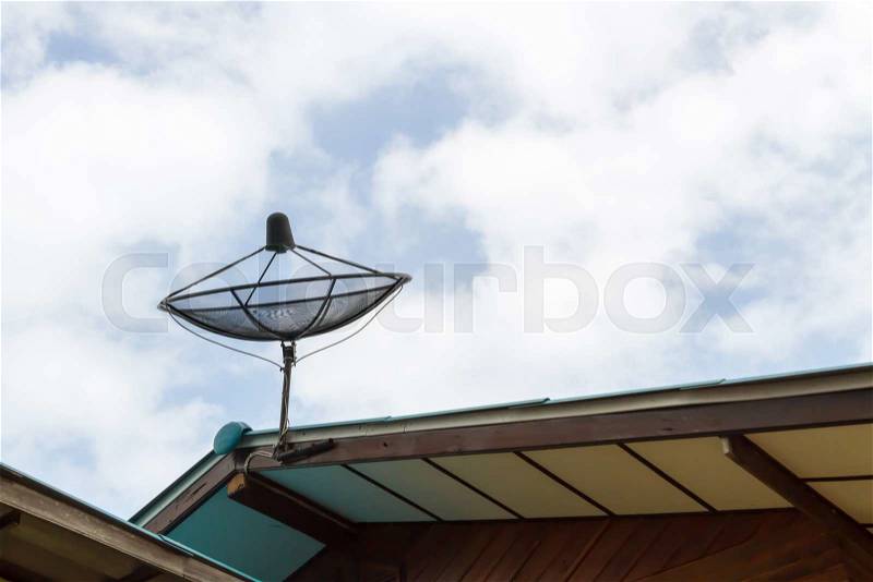 Satellite dish blue sky communication technology network on country home, stock photo