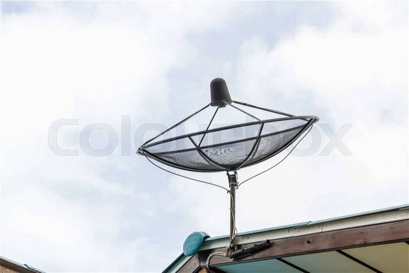 Satellite dish blue sky communication technology network on country home, stock photo